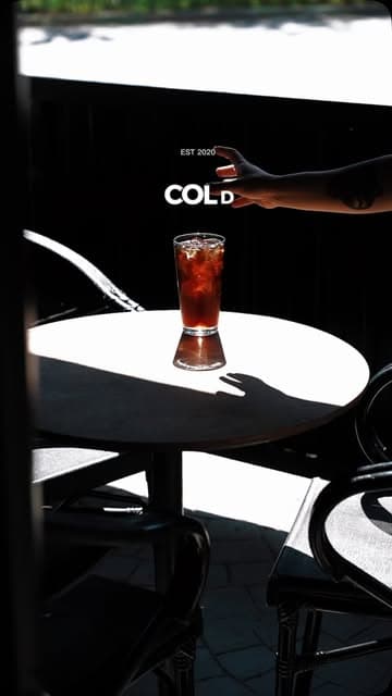 Two espresso streams pouring into a white cup